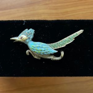 Signed “Ultra” gold tone enamel Roadrunner Brooch with blue/green rhinestones